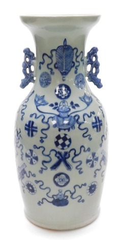 A 19thC Qing dynasty blue and white vase, celadon ground, of twin handled form, decorated with Buddhist emblems, 43.5cm high. (AF)