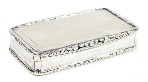 A George IV silver snuff box, with engraved decoration, within a gadrooned rim, gilt interior, Nathaniel Mills, Birmingham 1832, 2.71oz.