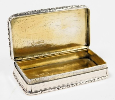 A George IV silver snuff box, with engraved decoration, within a gadrooned rim, gilt interior, Nathaniel Mills, Birmingham 1832, 2.71oz. - 2