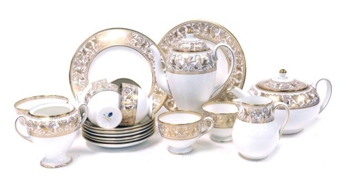 A Wedgwood porcelain Gold Florentine pattern part tea and coffee service, comprising tea pot, coffee pot, soup cruet, lid lacking, cream jug and sugar bowl, six tea cups and saucers and two bread plates.