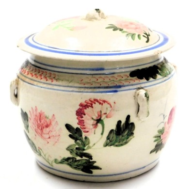 A late 19thC French pottery pot and cover, hand painted with flowers, 23cm wide. - 2