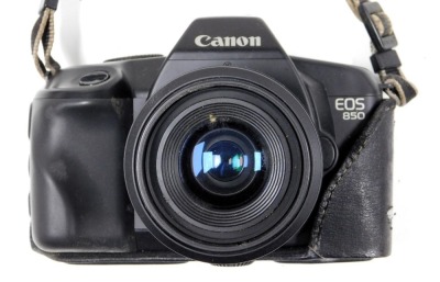 A Canon EOS 850 camera, with a Speedlight 160E, cased, and an Olympus C-50 zoom digital camera. - 4