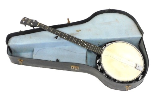 An early 20thC Melody-Jo four string banjo, cased.