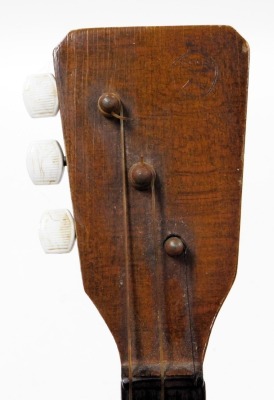 A late 20thC Soviet wooden cased balalaika, impressed CCCP mark, 66cm high. - 2