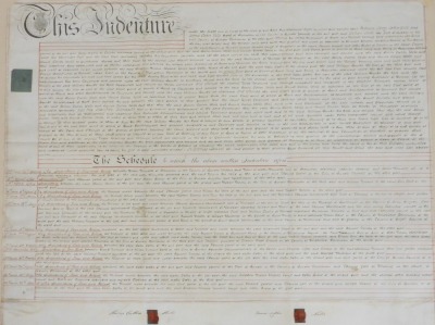 A George IV indenture between Henry Catten Wells and James Catten Wells, and William Lambe, in Lincolnshire, bears signatures and seals, framed and glazed, 71.5cm x 88cm.