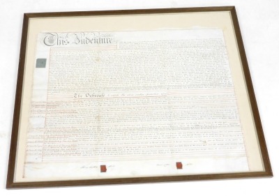 A George IV indenture between Henry Catten Wells and James Catten Wells, and William Lambe, in Lincolnshire, bears signatures and seals, framed and glazed, 71.5cm x 88cm. - 2