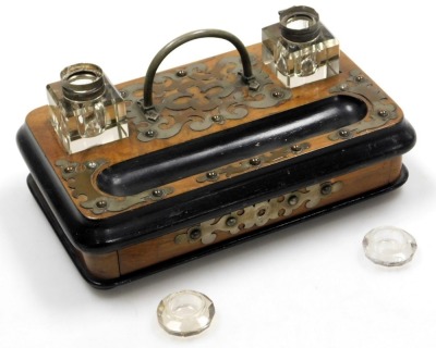 A Victorian walnut and ebonised desk stand, with brass mounts and cut glass inkwells, with a frieze drawer, raised on bun feet, 25cm wide. - 2