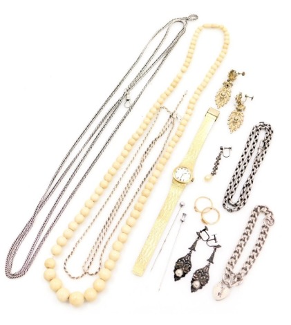 Silver and costume jewellery, including a string of graduated bone beads, silver chains, filigree earrings, dress wristwatch, and marcasite earrings.