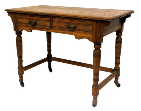 A Victorian oak wash stand, with two frieze drawers, raised on turned legs united by stretchers, brass capped on castors, 74cm high, 102cm wide, 53.5cm deep.