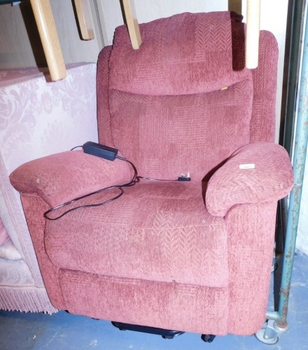 An electric reclining armchair, upholstered in red fabric. (1)