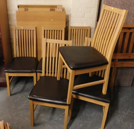 A modern oak finish dining table, together with six chairs with brown leatherette overstuffed seats. (7)