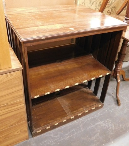 An early 20thC oak open cabinet, the top with a moulded edge, with fall to side, above two recesses with numbered partitions, 78cm high, 67cm wide, 55cm deep.