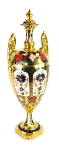 A Royal Crown Derby Old Imari porcelain twin handled vase and cover, gold ground, pattern 1128, printed marks, 43cm high, boxed.