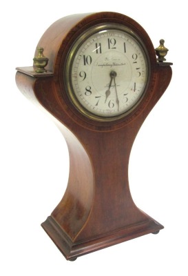 An early 20thC Art Nouveau mahogany and inlaid balloon shaped mantel clock, the circular white enamel dial bearing Arabic numerals for The London Manufacturing Goldsmiths Company, Nottingham, with brass urn finials to case, eight day movement, 25.5cm high