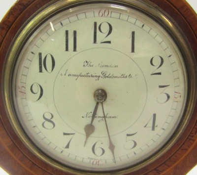 An early 20thC Art Nouveau mahogany and inlaid balloon shaped mantel clock, the circular white enamel dial bearing Arabic numerals for The London Manufacturing Goldsmiths Company, Nottingham, with brass urn finials to case, eight day movement, 25.5cm high - 2