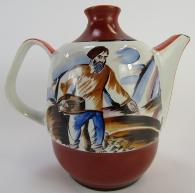 An early 20thC Russian propaganda porcelain teapot, depicting a scene commemorating the end of the Russian Civil War, the front painted with a Bolshevik holding gun standing above map with the dates 1918-1923 verso painted with a depiction of a farm labou - 2