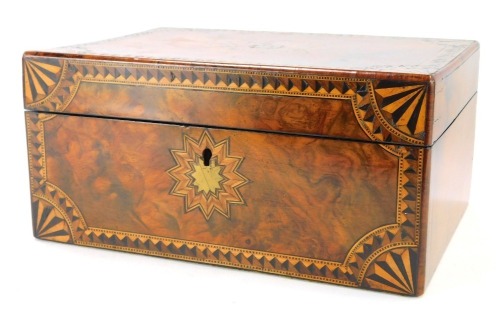 A Victorian walnut and inlaid sewing box, the hinged lid with double star motif, initialled JAB, enclosing an interior with various recesses, 13cm high, 27.5cm wide, 20cm deep.