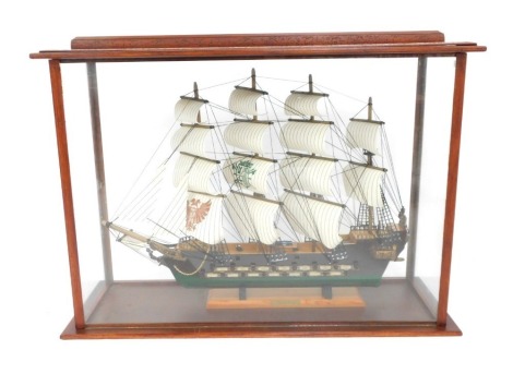 A scratch built model of a 16thC frigate, with four sails, 62cm wide, in a glass and wooden case, 60cm high, 88cm wide, 32cm deep.