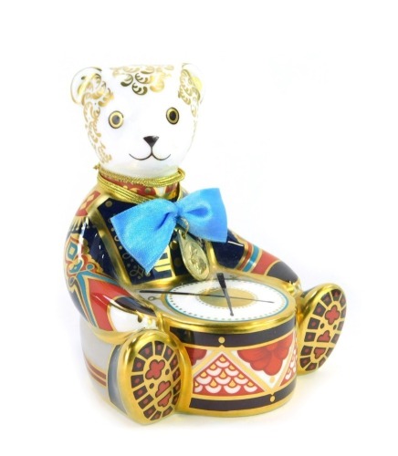 A Royal Crown Derby porcelain Drummer Bear paperweight, gold stopper and red printed marks, 11cm high, boxed.