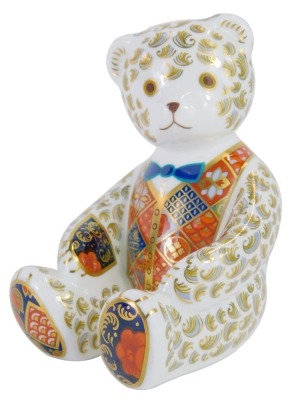 A Royal Crown Derby porcelain paperweight, modelled as a seated Teddy bear, gold stopper and red printed marks,11cm high, boxed.