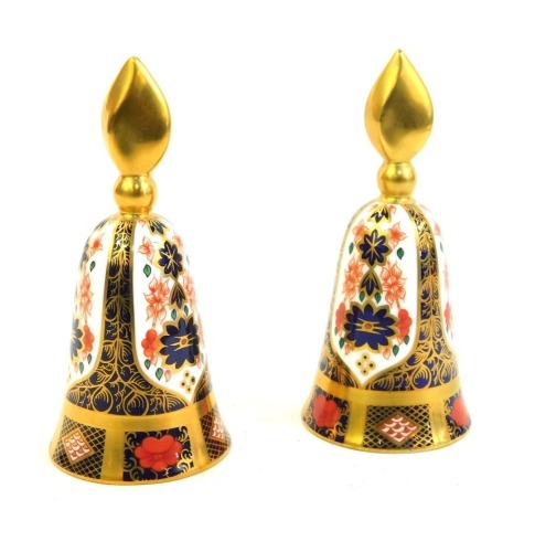 Two Royal Crown Derby Old Imari porcelain candle snuffers, gold ground, pattern 1128, red printed marks, 12cm high, both boxed.