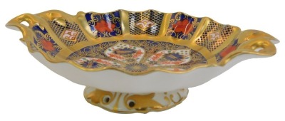 A Royal Crown Derby Old Imari porcelain twin handled pedestal sweetmeat dish, gold ground, pattern 1128, red printed marks, 16cm wide.