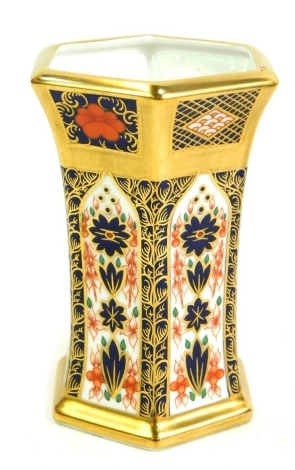 A Royal Crown Derby Old Imari porcelain vase, of hexagonal form, gold ground, pattern 1128, 11cm high, boxed.