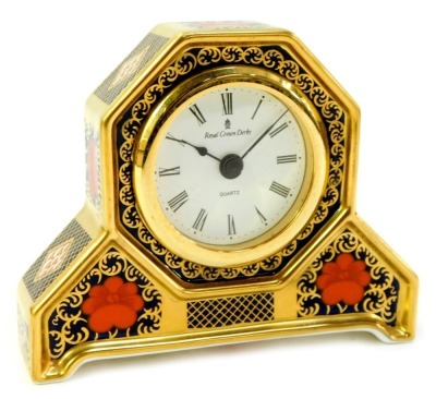 A Royal Crown Derby Old Imari porcelain desk clock, gold ground, pattern 1128, the circular dial bearing Roman numerals, quartz movement, red printed marks, 11cm high, boxed.