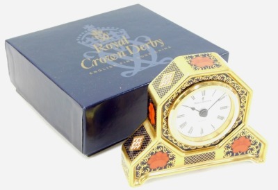 A Royal Crown Derby Old Imari porcelain desk clock, gold ground, pattern 1128, the circular dial bearing Roman numerals, quartz movement, red printed marks, 11cm high, boxed. - 4