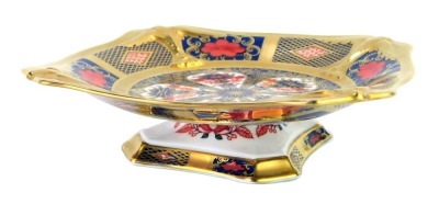 A Royal Crown Derby Old Imari porcelain pedestal sweetmeat dish, gold ground, of square shaped form, pattern 1128, a 1996 Exclusive for The Royal Crown Derby Collectors Guild, red printed marks, 14cm wide, boxed.