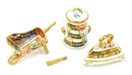 A group of Royal Crown Derby miniatures Imari porcelain, comprising traditional Imari Iron, Tree of Life urn and Water Garden wheelbarrow (AF), all boxed.