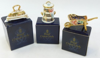 A group of Royal Crown Derby miniatures Imari porcelain, comprising traditional Imari Iron, Tree of Life urn and Water Garden wheelbarrow (AF), all boxed. - 3