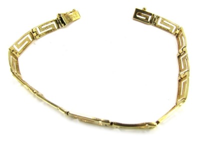 An Eastern inspired bracelet, Greek key design, yellow metal, stamped 585 to clasp, 19cm long, 6.9g all in.