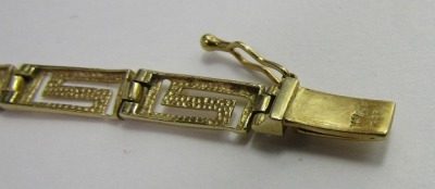 An Eastern inspired bracelet, Greek key design, yellow metal, stamped 585 to clasp, 19cm long, 6.9g all in. - 2