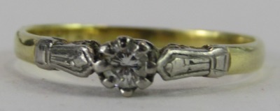 A diamond solitaire dress ring, the tiny diamond in claw setting, with white metal shoulders, on yellow metal band, stamped 18t plat, ring size O½, 1.7g all in. - 3