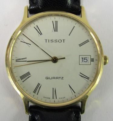 A Tissot gentleman's wristwatch, the cream Roman numeric dial with date aperture, in yellow metal case stamped 375 with import marks, 3cm wide, on a black leather strap, 25.4g all in. - 2