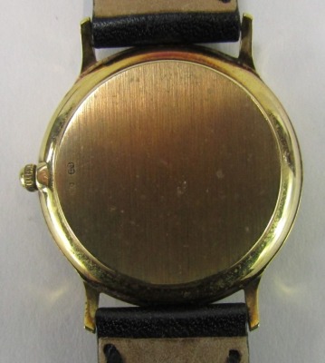 A Tissot gentleman's wristwatch, the cream Roman numeric dial with date aperture, in yellow metal case stamped 375 with import marks, 3cm wide, on a black leather strap, 25.4g all in. - 3