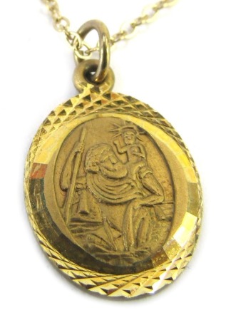 A 9ct gold St Christopher pendant on fine link chain, the pendant 1cm high, the chain 44cm long, 2.2g all in, boxed.