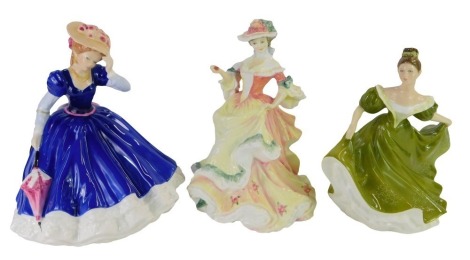 Three Royal Doulton porcelain figures, modelled as Figure of The Year Mary HN33775, Flowers Of Love Rose HN3709 and Lynne HN2329, each boxed.