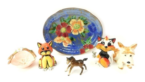 A group of ceramics, comprising a Royal Doulton oval dish decorated with flowers, printed marks, 28cm wide, two Lorna Bailey cat figures, Beswick foal, Sylvac dog, and a Sylvac basket modelled as a pink flower. (6)