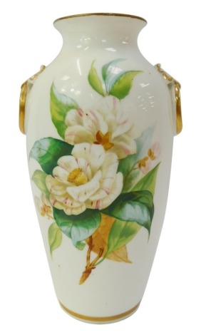 A Victorian porcelain two handled vase, of cylindrical tapering form, decorated with flowers to the front and verso, with gilt heightened integrated ring handles, restored, 23cm high.