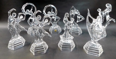 A group of moulded glass figures, modelled as dancers, in various poses, the largest 29cm high. (a quantity)