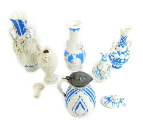 A group of Victorian and later bisque porcelain relief moulded wares, to include a Cashmere Cobridge jug, with pewter lid, impressed marks, 18cm high, two handled vase, 35cm high, etc. (many pieces AF)