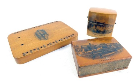 A group of Mauchline ware, comprising a match case for Harrogate, 4.5cm wide, a score board for St Catherine's Rock Tenby, and a ring box for Burns Cottage.