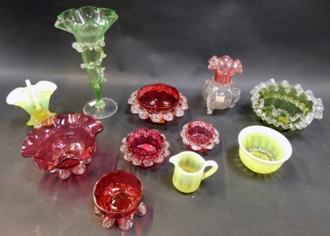 A group of Victorian and later coloured glass, to include a green tinted vase of trumpet form, 21cm high, a cranberry glass sugar bowl, 13cm diameter, vaseline glass etc., (quantity)