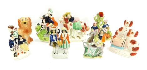 19thC and later Staffordshire figures, to include figure of a lady seated on spaniel, 22cm high, spill vase depicting male and female seated beside stag, 22cm high, figure of a gentleman on horseback, 24.5cm high, etc.