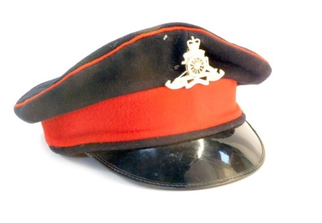 An Indian Officer's peaked cap, bearing 1903 cap badge .