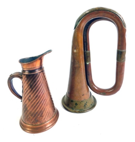 A Rushworth & Dreater Liverpool copper and brass bugle, No 4343, 27cm long, together with a 19thC copper jug, of cylindrical tapering fluted form, 18cm high. (2)