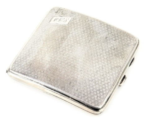 A George V silver cigarette case, with engine engraved decoration bearing the initials OCJ, Birmingham 1931, 3.76oz.