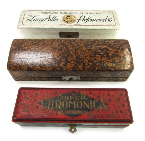 A Larry Adler Professional 16 chromatic harmonica by M Hohner, boxed, together with a Super chromonica harmonica by Hohner, and another.